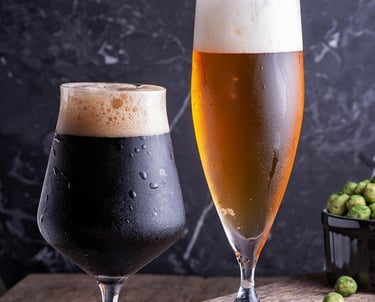 One short glass of stout with a taller glass of lager