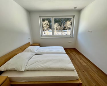 a bed with a bed and a window