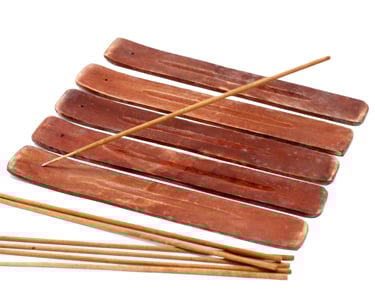 a bunch of sticks sticking out of a wooden sticker