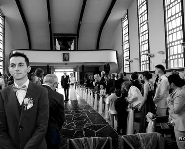  photographe mariage florent lille saint omer touquet man in a suit and bow tie standing in a church