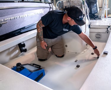 Vital Marine technician performing 3D digital scan of boat deck for custom SeaDek design in Ontario