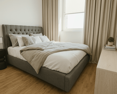 a bed with a large bed and a television