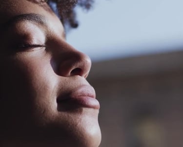 a woman with her eyes closed and her eyes closed