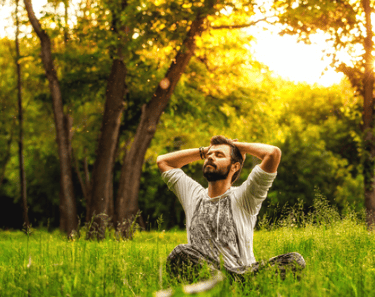 Man practicing mindfulness meditation and enjoying the present moment.. 
