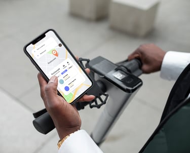 a person holding a cell phone in their hand