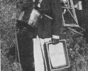 a man in a mining outfit holding mining equipment