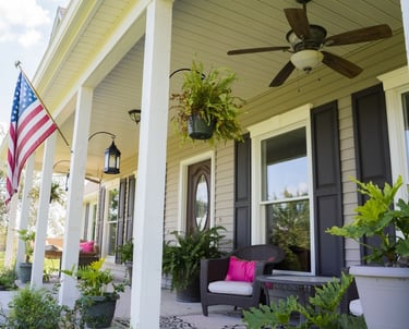 porch with white windows and black shutters