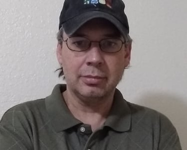 a man in a hat and glasses