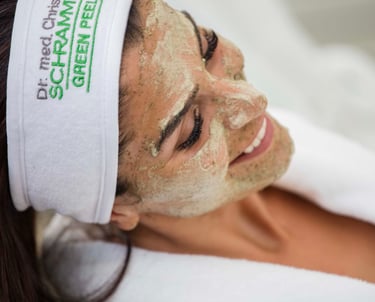 a woman with a towel wrapped around her face of dr schrammek