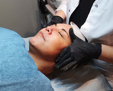 a woman getting a facial lift in a beauty salon