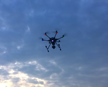 a small drone flying through the sky