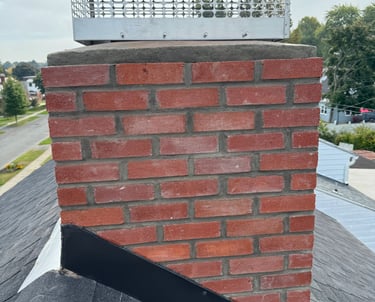 Chimney specialist rebuild shimney from roof line
