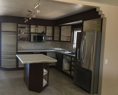 a kitchen with a refrigerator and a refrigerator freezer