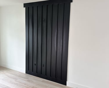 Interior door remodeling project featuring new white panel doors and black matte handles in resident