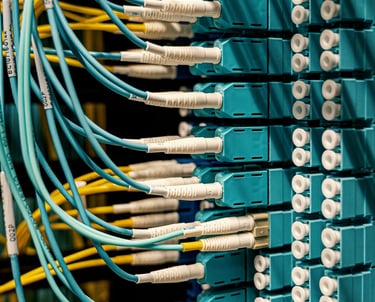 a bunch of cables connected to a computer terminal