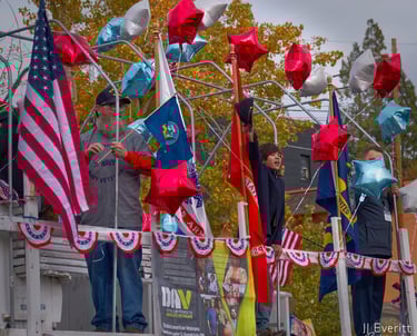 a group of people standing on a float boat