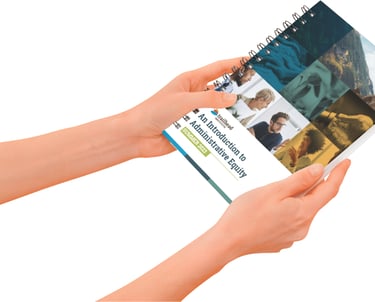 a person holding a book with a magazine on it