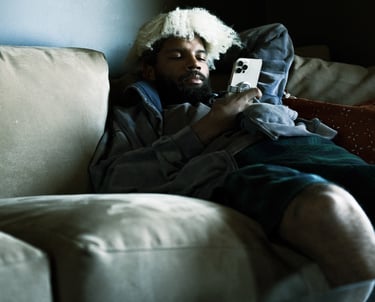 Commercial video production company: man lying on a couch with a book