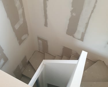 Pose de Placo dans une cage d'escalier