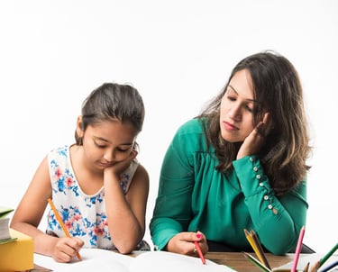 Teacher offering personalized attention to students at Ciel Knowledge coaching center for IIT-JEE
