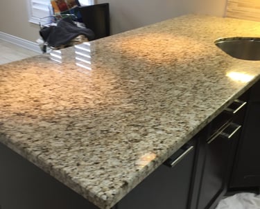 Finely polished Granite Kitchen Counter reflects light beautifully