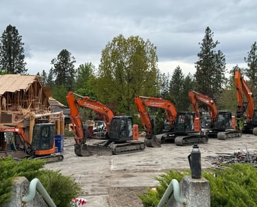 Five excavators in a row