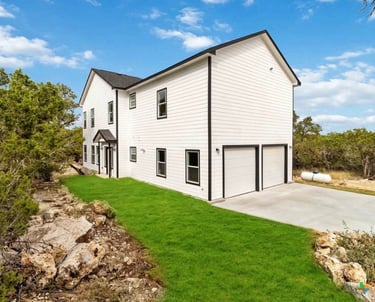 Custom home in Wimberley, Texas with solar panels and large backyard