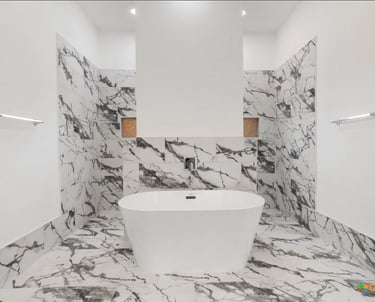 Modern soaking tub with separate vanities in primary bathroom