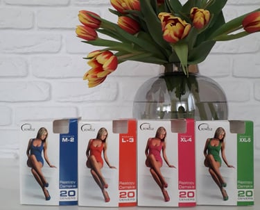 a vase with a vase of flowers in front of a white brick wall