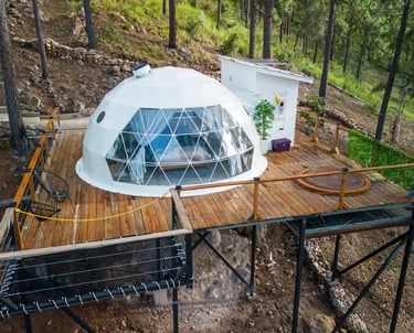 a dome shaped house with a glass dome shaped like a dome