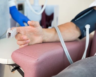 a person with a blood pressure monitor on their arm