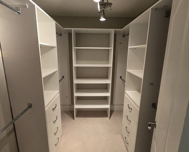 walk-in closet with varies shelfing and drawers