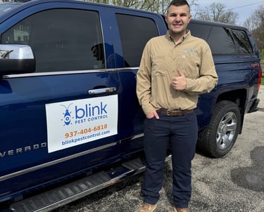 Blink Pest Control Owner standing by truck