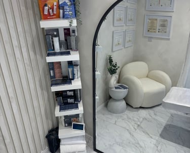 inside of beauty clinic showing clean boutique space and beauty products