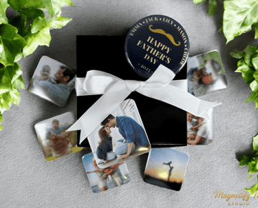 Personalized Father's Day gift box with custom photo magnets and a white ribbon bow.