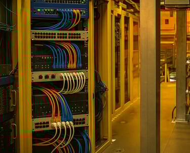 a server room with a lot of wires and wires