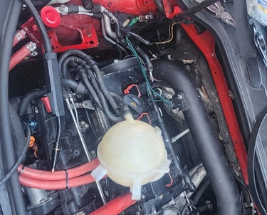 Battery wires inside engine compartment