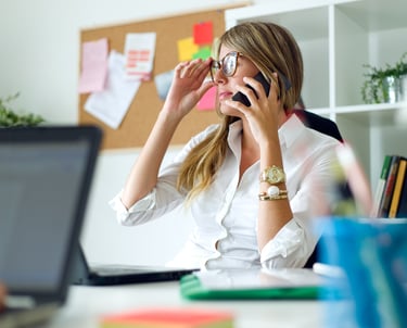 a woman in a white shirt and a laptop computer
