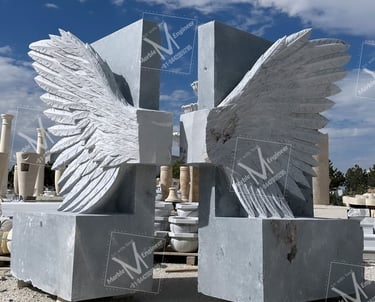 a statue of a winged cross with wings