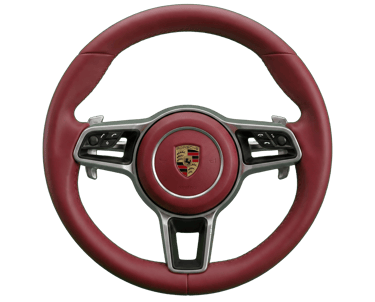 Luxury red leather Porsche steering wheel with silver accents and center crest logo on a black background.