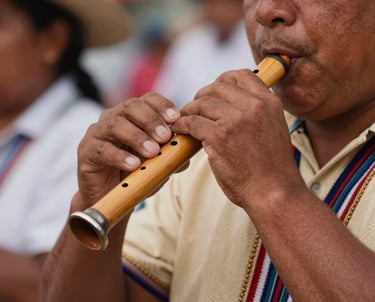 Close-up of a musician playing a Zampoña (pan flute) at a community event, South American / Brazilian / Bolivian cultural festival setting, focus on the hands and the instrument, warm Sand tones.