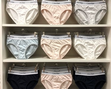 A close-up of a delicate lace bra in soft pastel tones, highlighting intricate stitching and comfort.