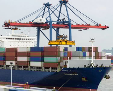 A team of professionals discussing international trade strategies around a conference table.