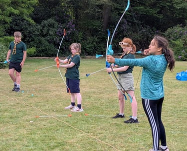 Scouts using bows while on a trip out from Allerton