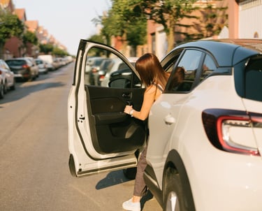 Driver getting into a reliable weekly rental car for gig work in Tucson Arizona