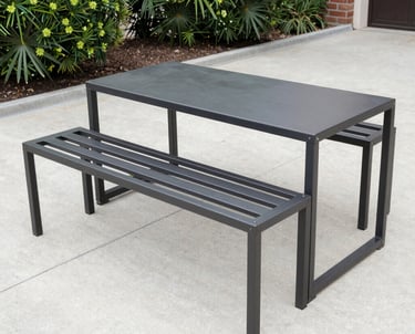 Artistic metalwork showing decorative welded designs on a gate.