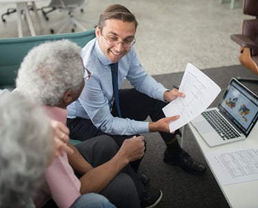 Agent presenting to client couple