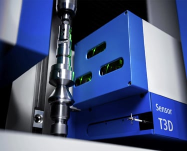 Precision turned part being inspected by optical shaft scanner and a scanning touch probe.