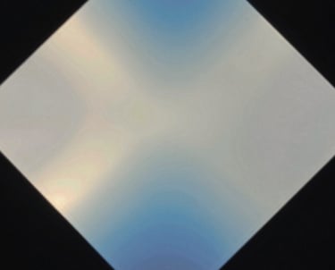 Abstract photography of light refraction through a glass prism, creating soft blue and off-white gradients, evoking a sense of deep learning neural networks.
