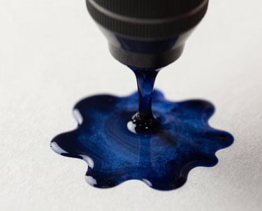 Macro shot of ink on high-quality paper. Deep navy blue on off white, reflecting precision and craft. North American / International feel.